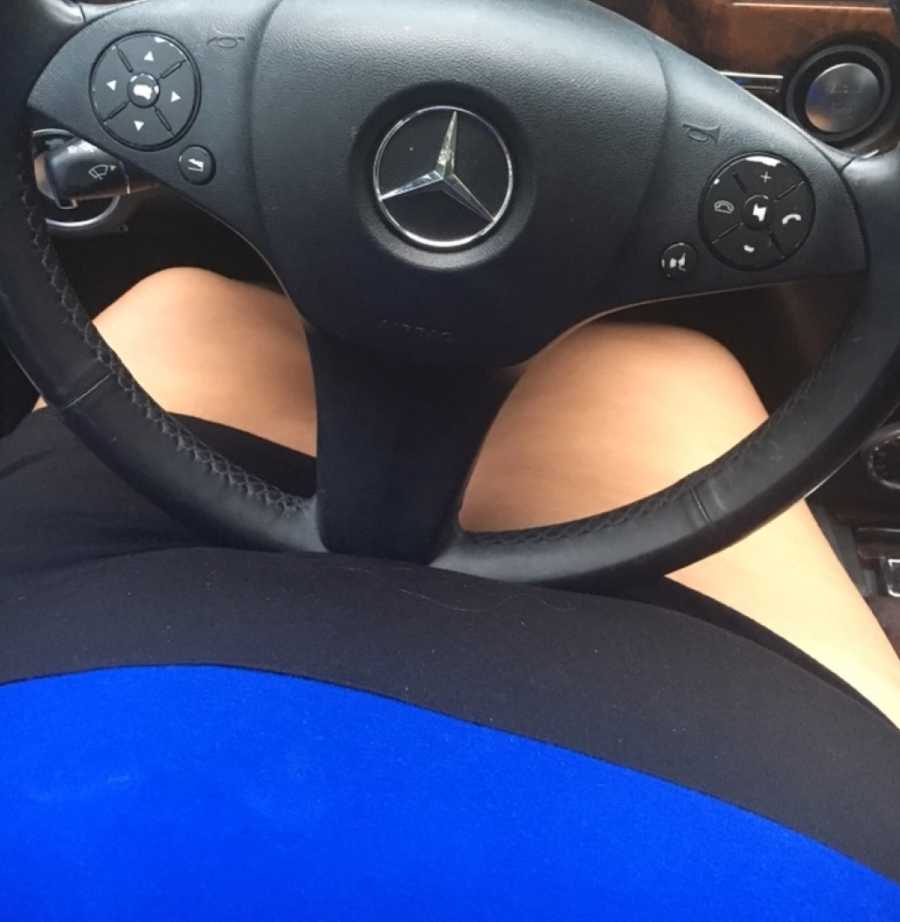 View of teen who is bullied for her weight sitting in drivers seat of Mercedes 