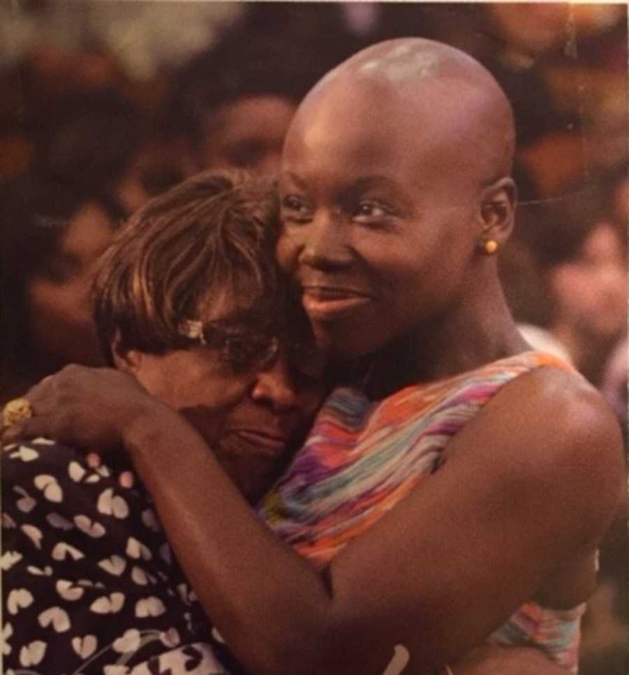 Young woman with breast cancer hugging her mother