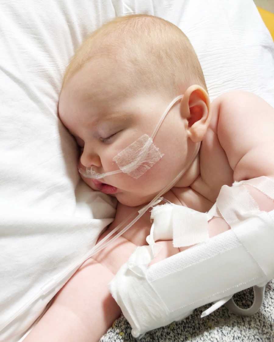 Baby who needs heart surgery lays asleep in PICU on oxygen