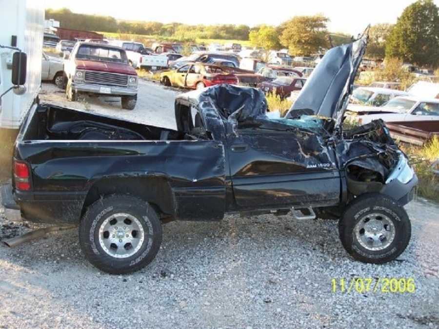 Destroyed truck from car crash that injured high school teen