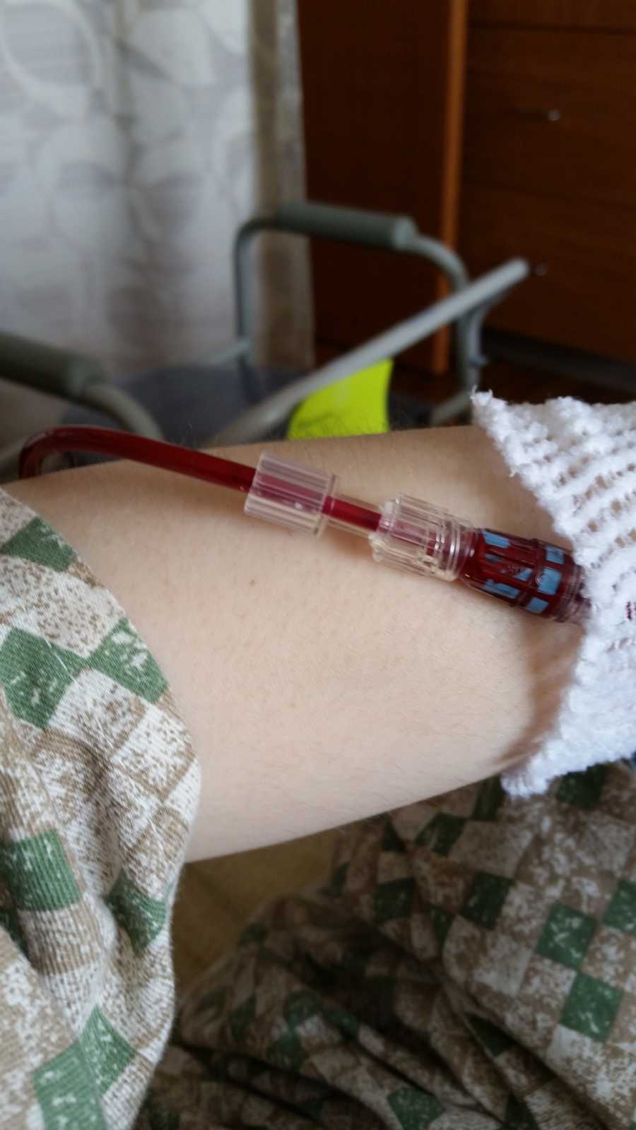 Close up of IV of blood in woman's arm