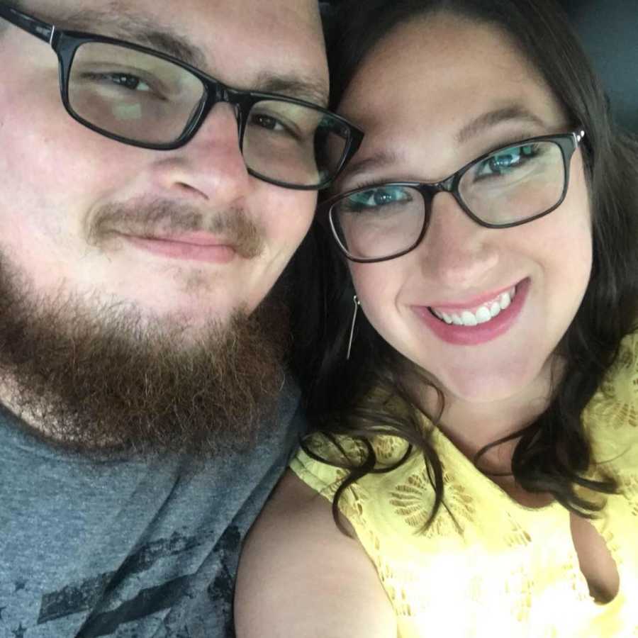 Woman smiles in selfie with boyfriend after her divorce