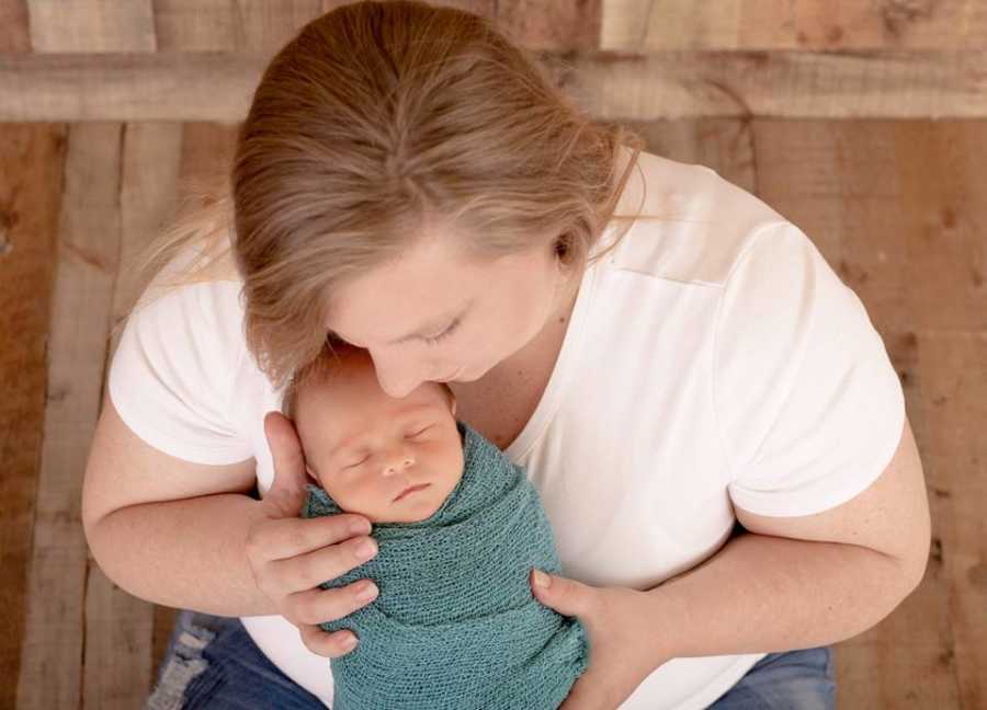 Aerial view of mother holding her baby with neuroblastoma