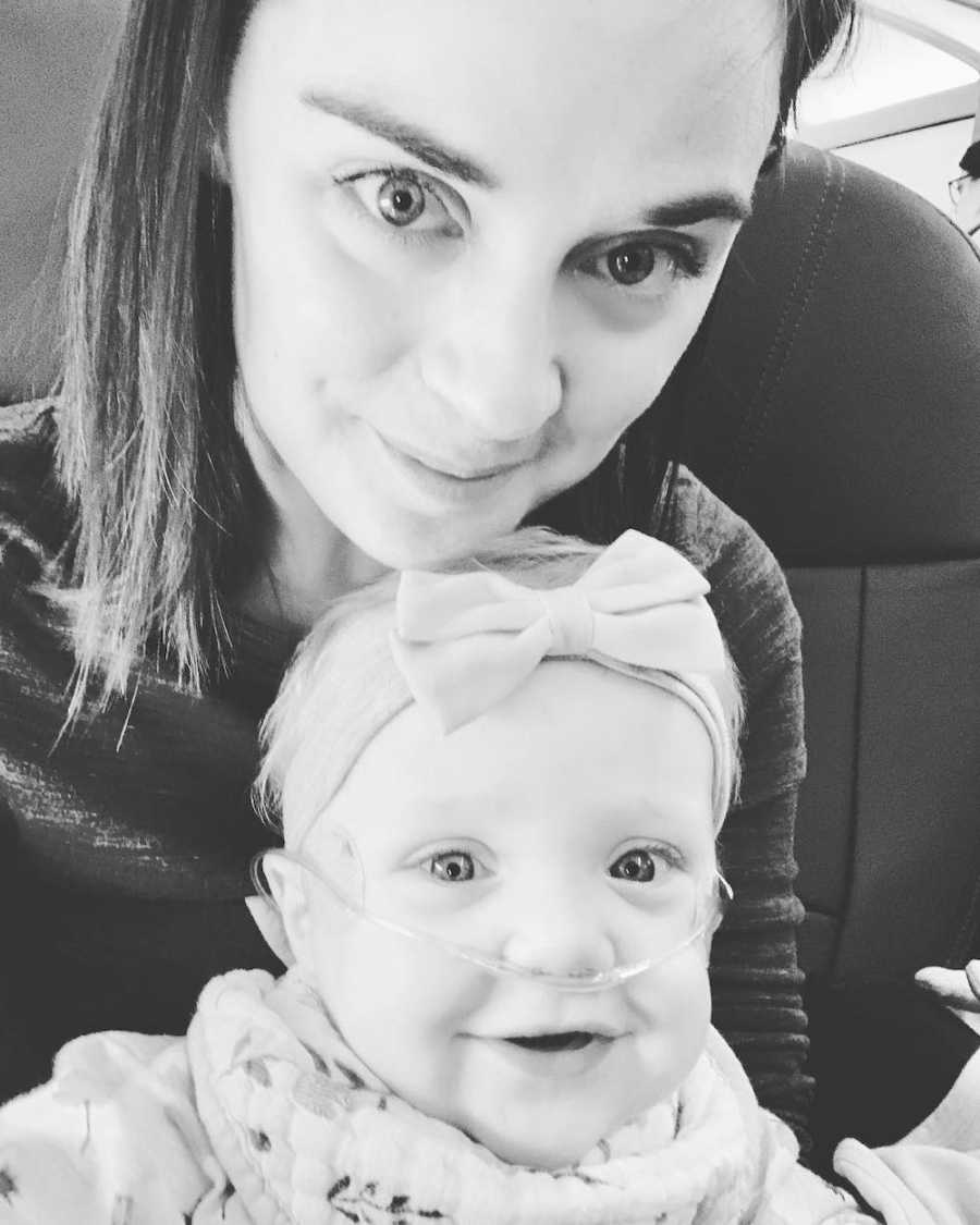 Mother who wants to thank stranger on plane for act of kindness takes selfie with baby daughter with special needs