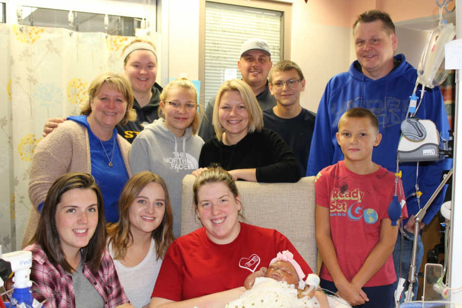 Mother sits in NICU with newborn who will soon die surrounded by family members