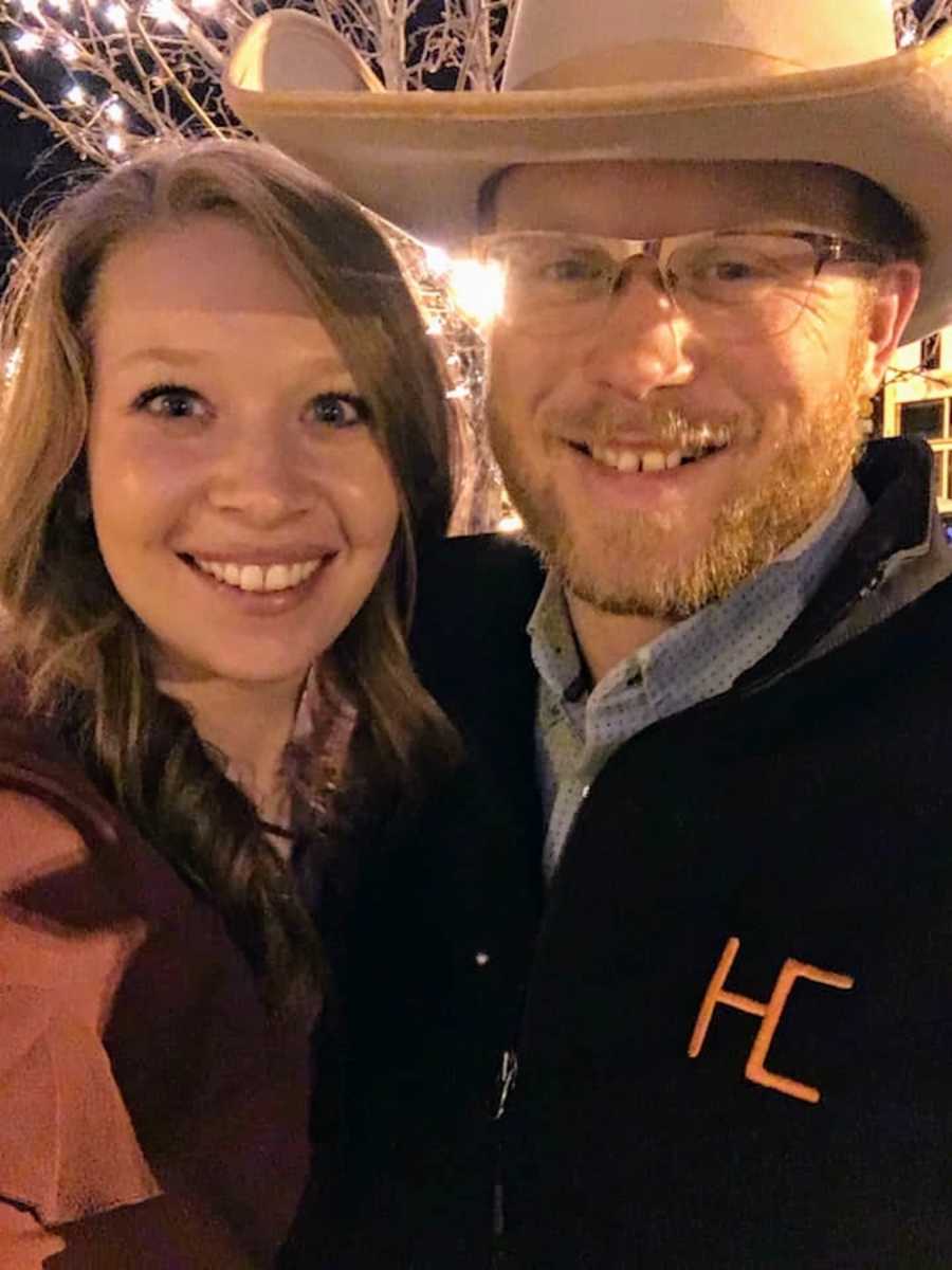 Husband and wife smile in selfie on their first date since having kids