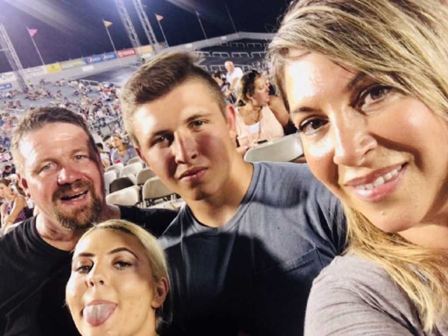Mother who lost their baby smiles in selfie with husband and teen son and daughter