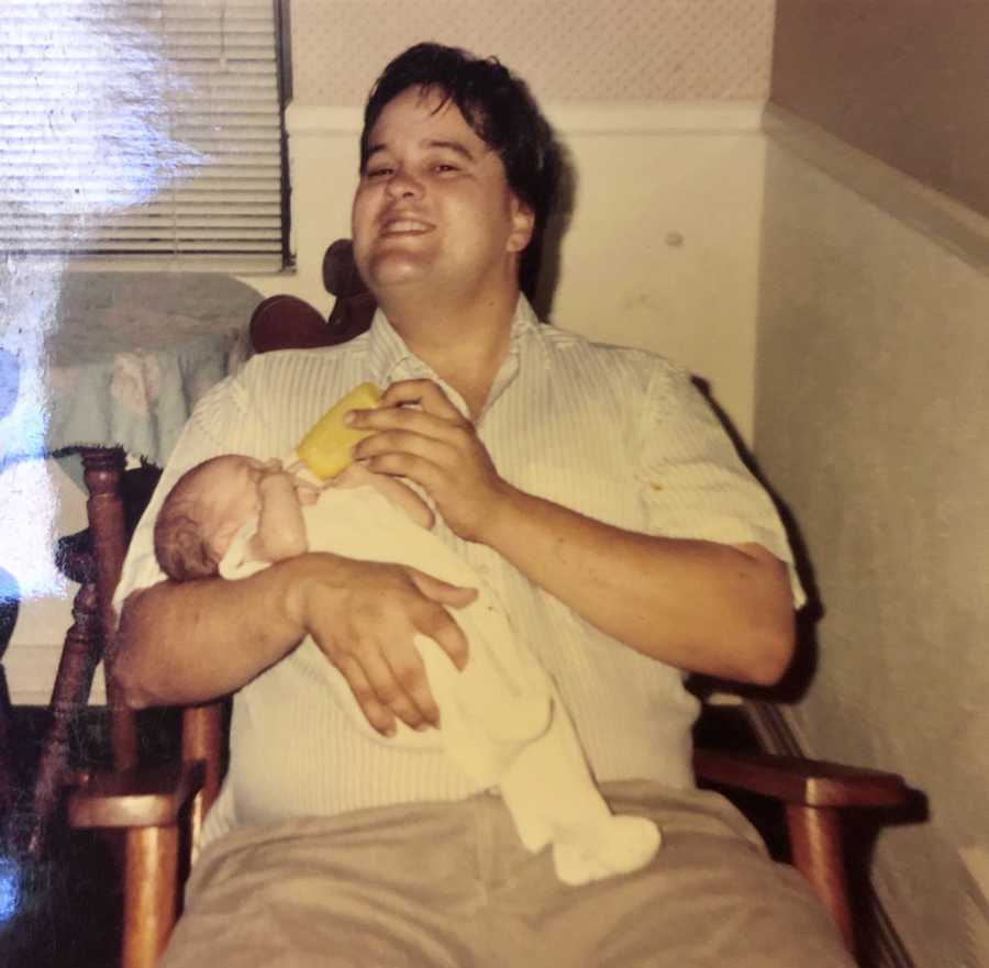 Man who was murdered sits in rocking chair feeding baby