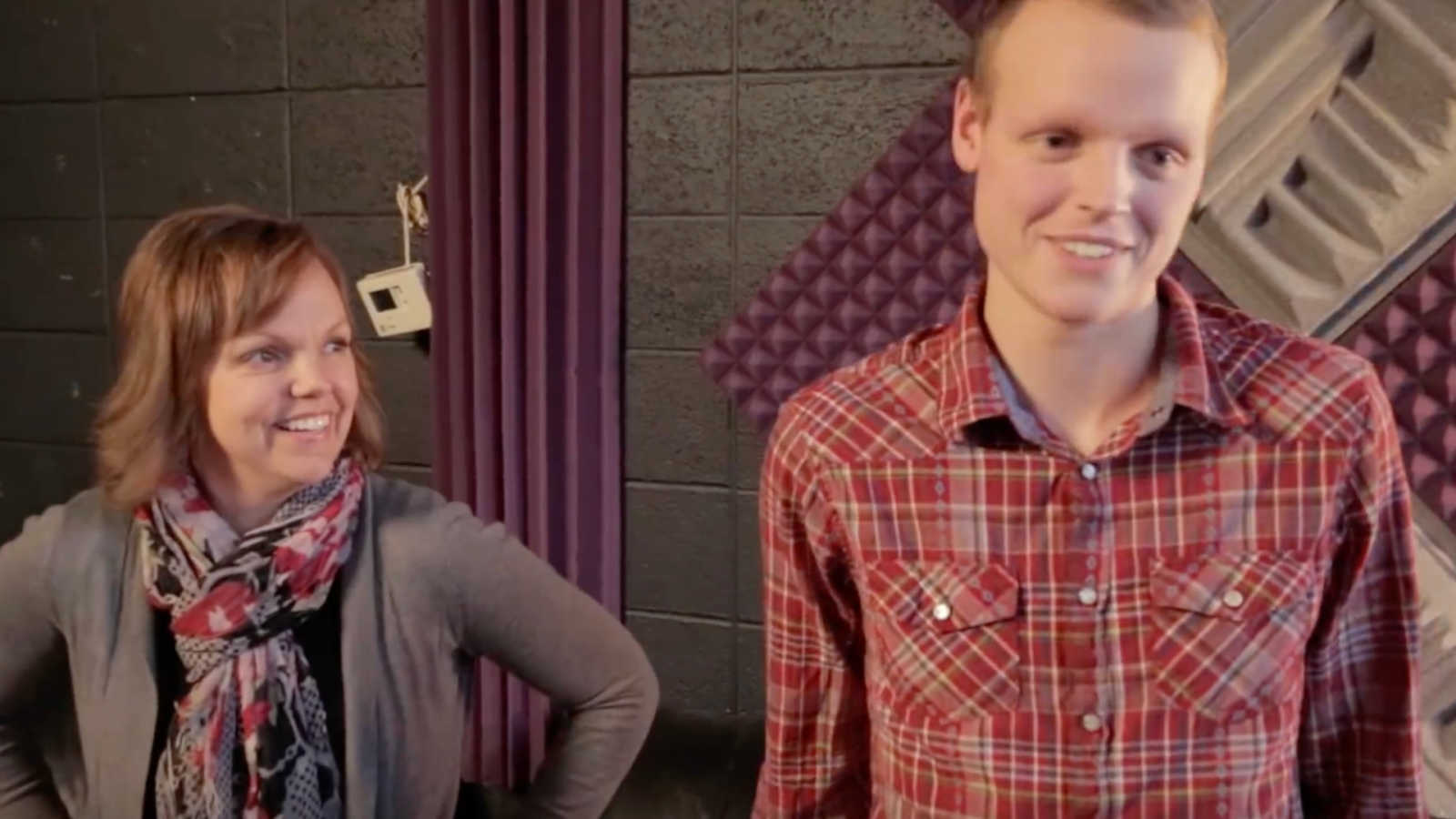 Teen with bone cancer who has since passed away stands beside mother in recording studio