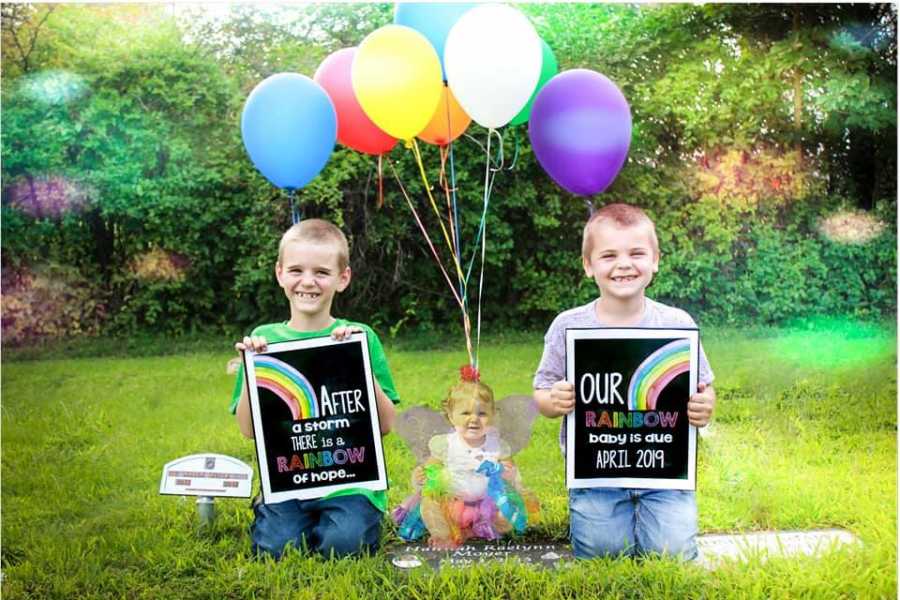 Brothers sit on either side of baby sisters grave as ghost of her sits in between them with balloons