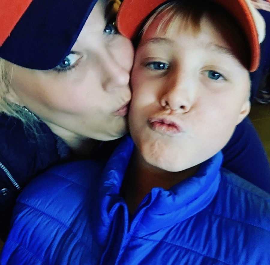 Mother smiles in selfie as she kisses cheek of young son who died from "pass out challenge"