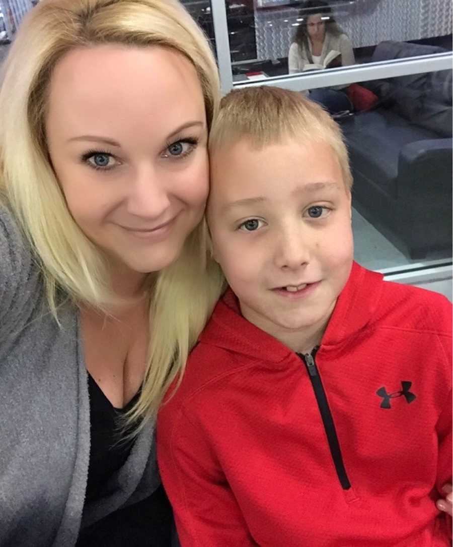 Mother smiles in selfie with young son she lost to "pass out challenge"