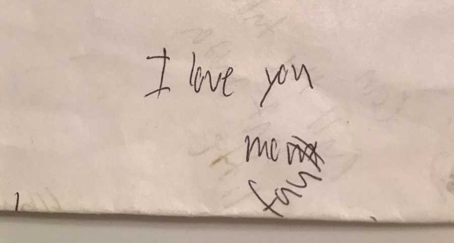Writing on paper saying "I Love You" written by man who was in car crash