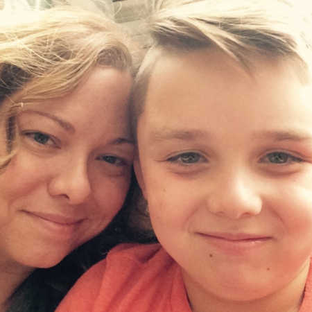 Widow smiles in selfie with young son whose father passed from colon cancer