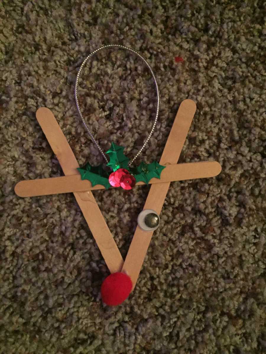 Reindeer ornament made out of popsicle sticks woman's late son made when he was a little kid