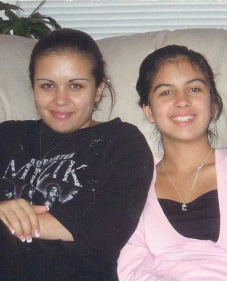 Little sister sits beside older sister on couch who has since died from committing suicide