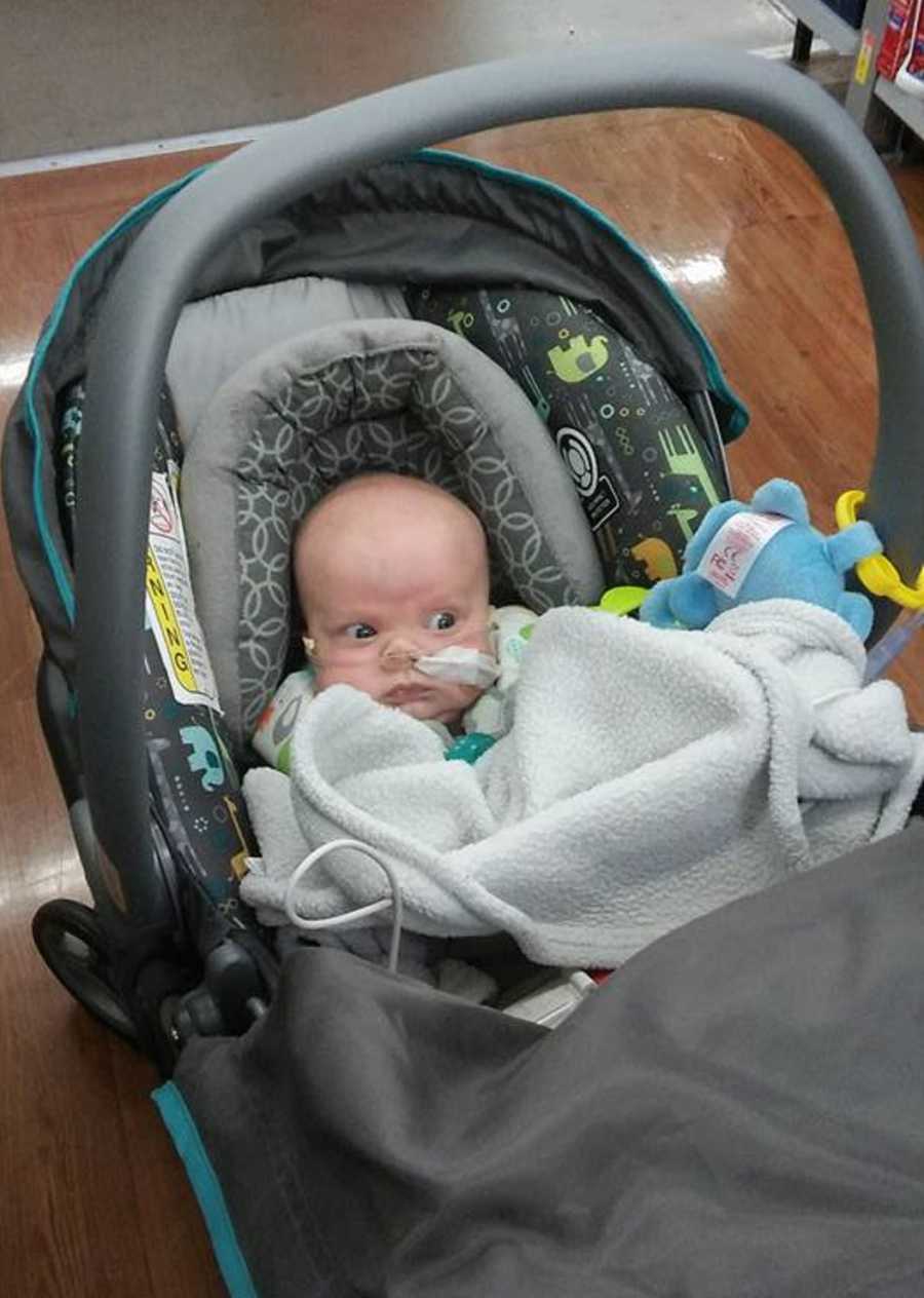 Newborn who had brain cancer sits in car seat ready to go home 