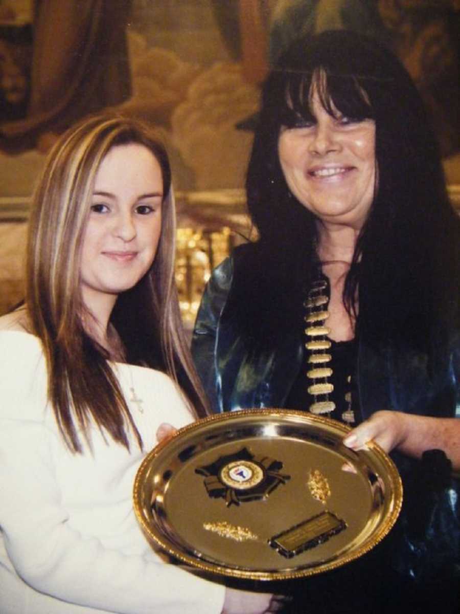 Teen with Exomphalos holds gold platter with mother