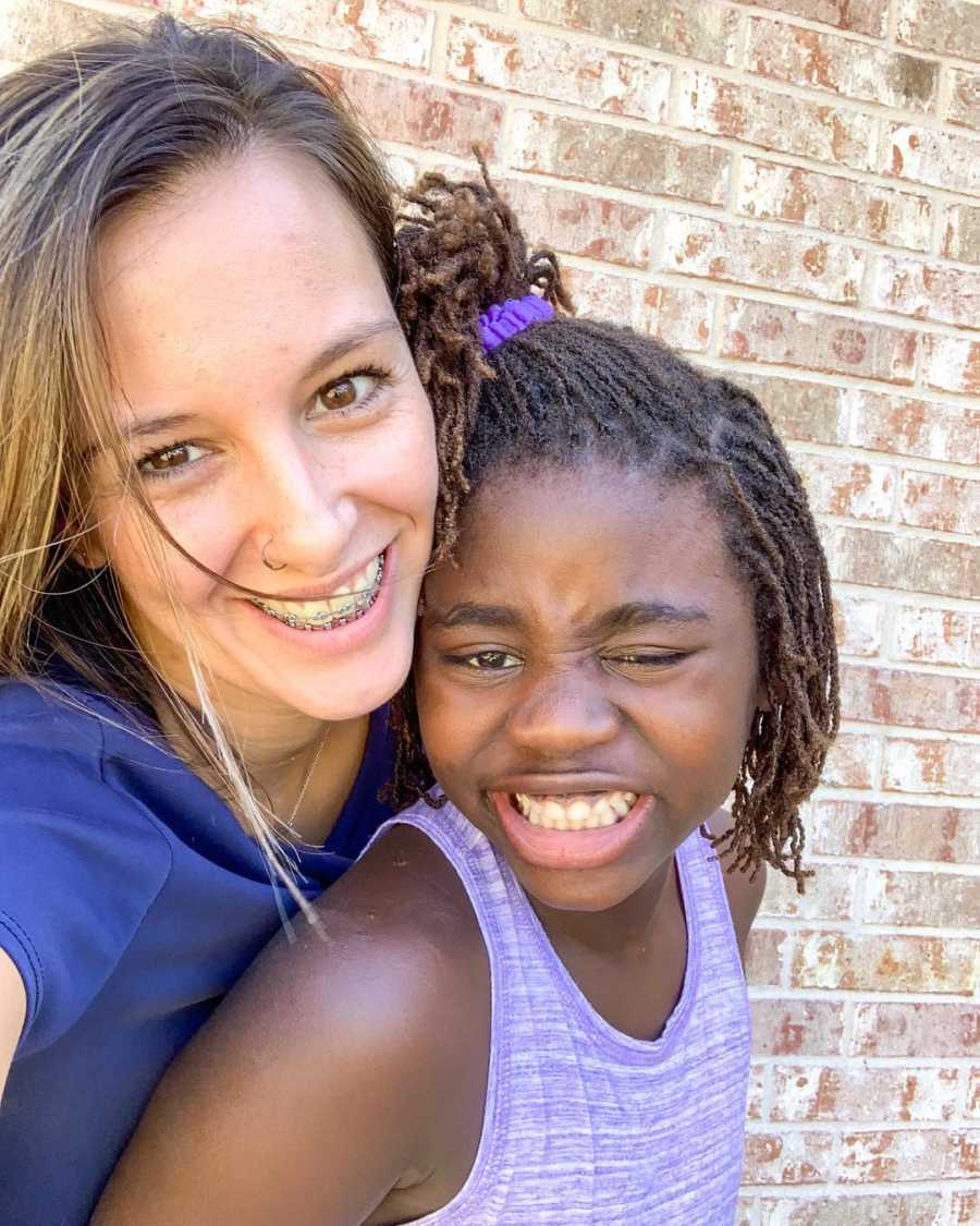 Mother smiles in selfie with her adopted daughter