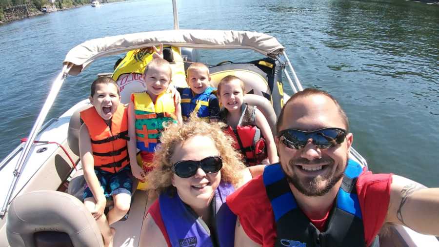 Husband takes selfie on boat with wife and four children