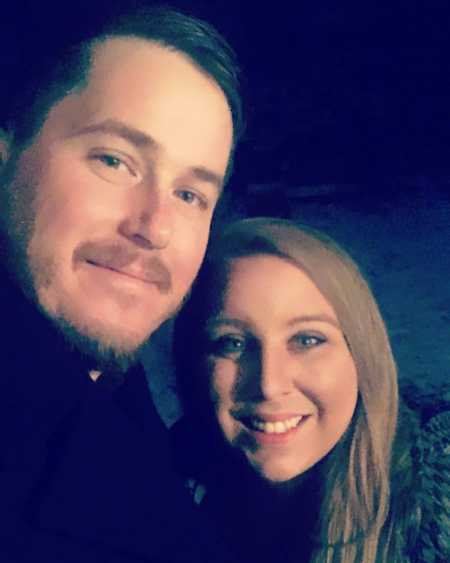 Woman smiles in selfie with boyfriend after losing baby