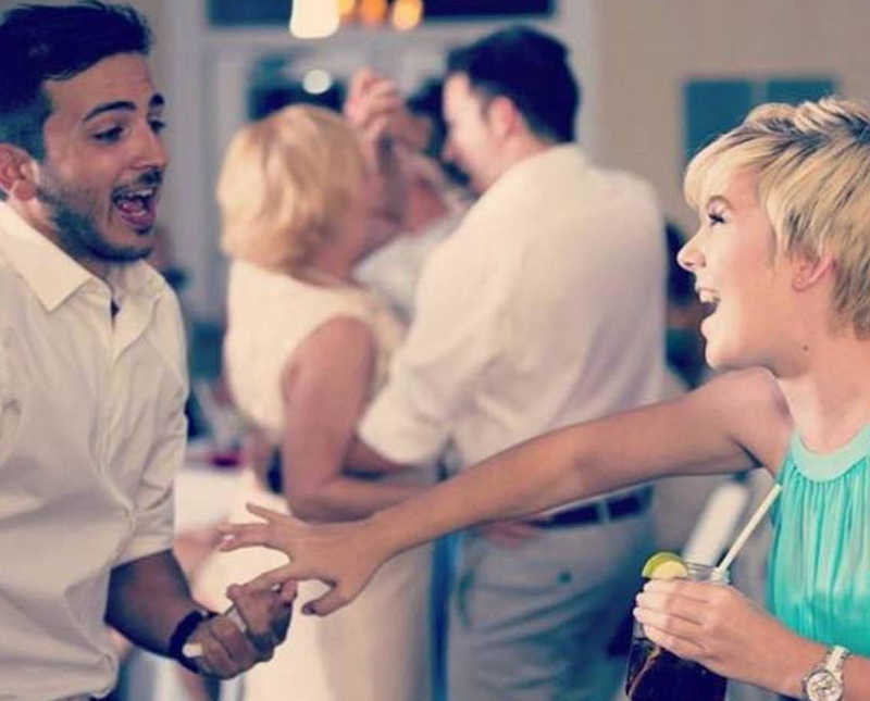 Woman smiles at her late cousin as they dance