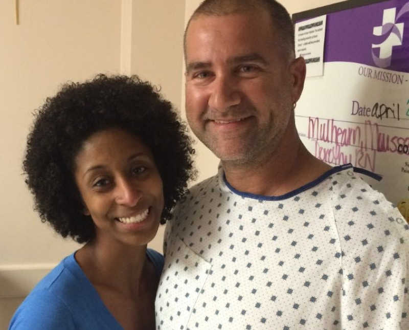 Woman stands beside fiancee with congestive heart failure in hospital 