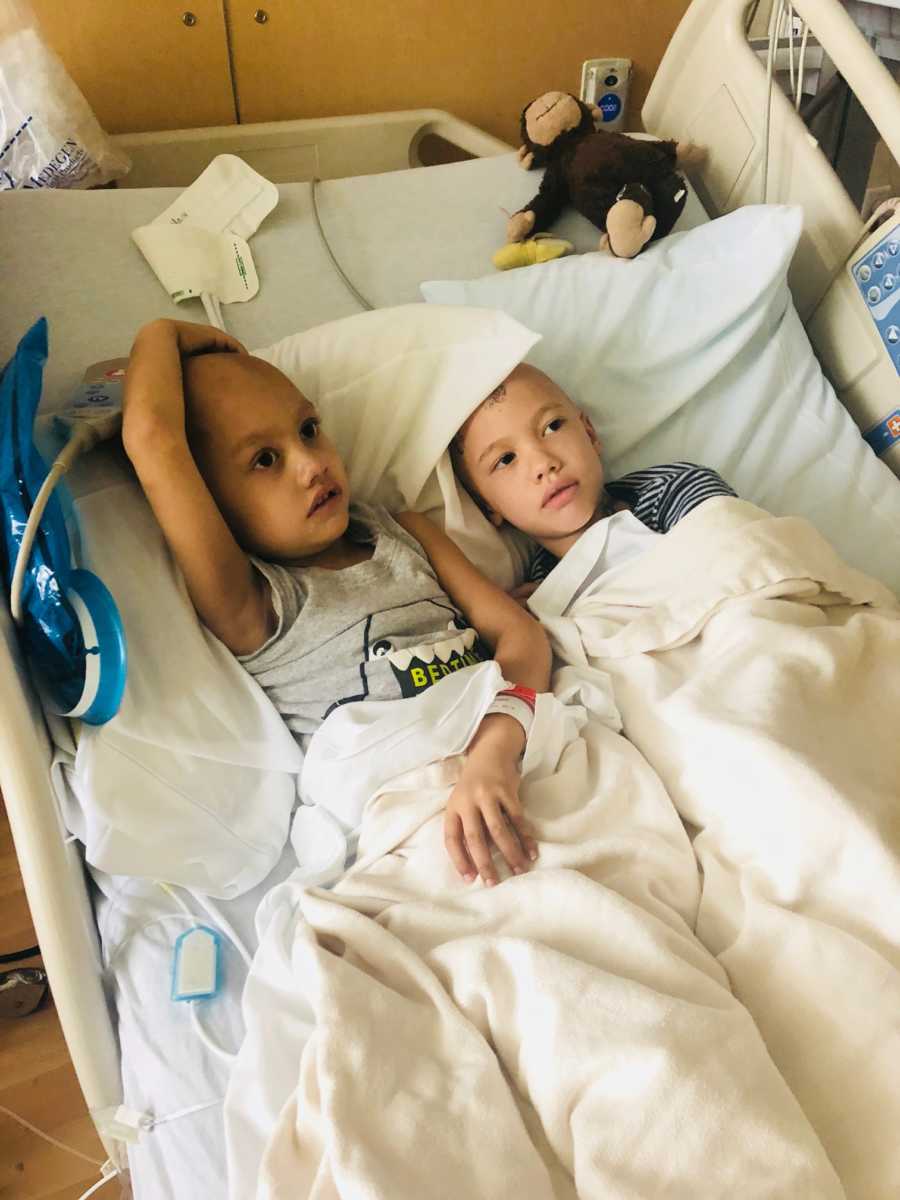 Brother and sister with brain cancer lay in hospital bed together