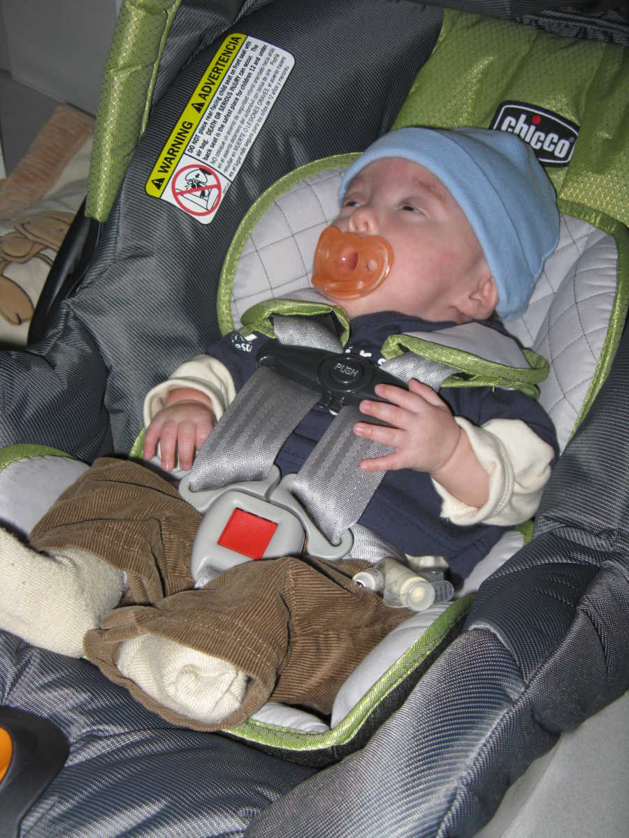 Baby sits in carseat ready to go home after spending five months in NICU