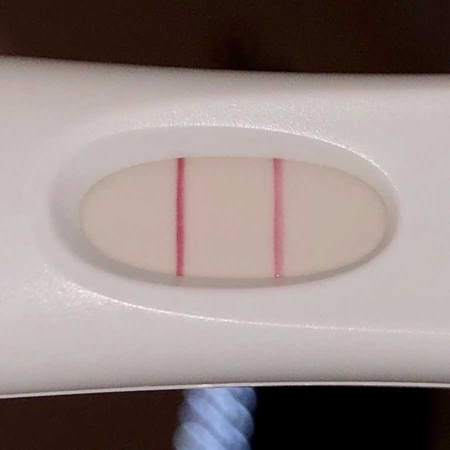 Close up of two red lines on pregnancy test