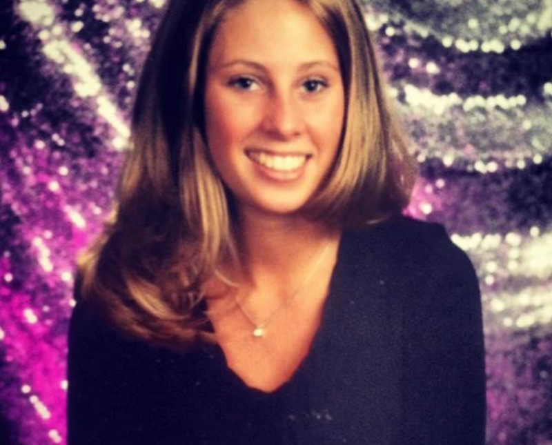 Teen girl smiles for school picture