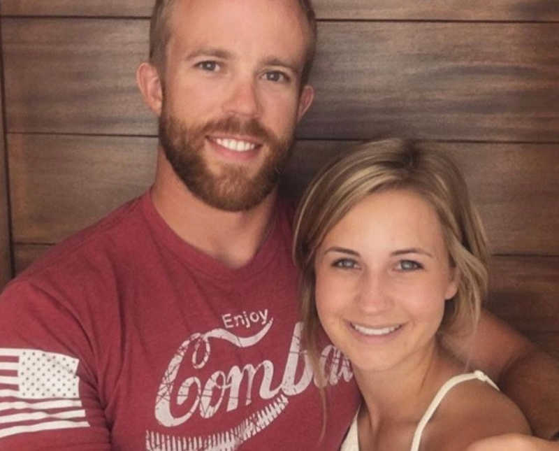 Husband and wife who lost their child and decided to foster stand smiling