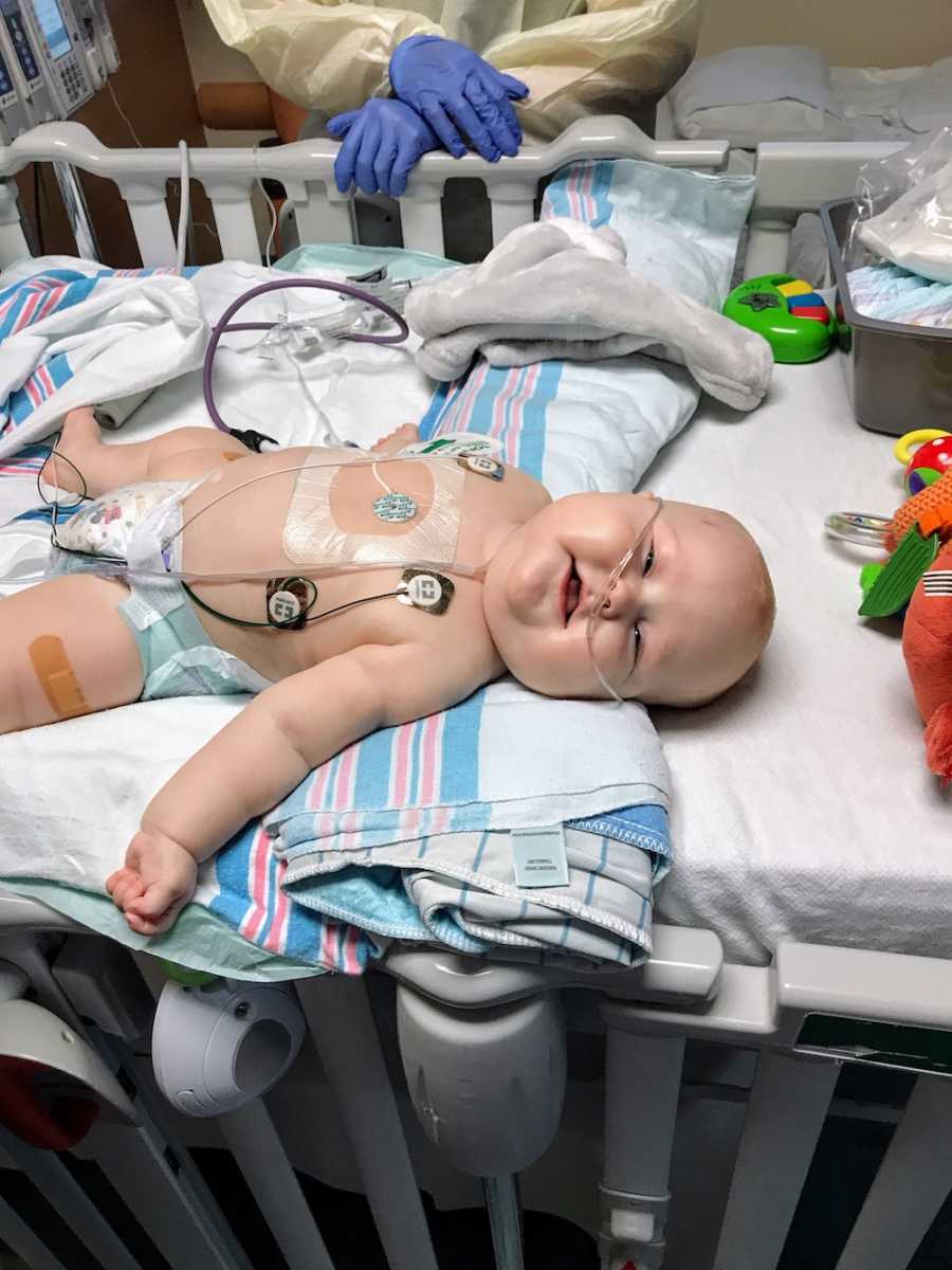 Baby boy with acute lymphoblastic leukemia lays in PICU hooked up to monitors