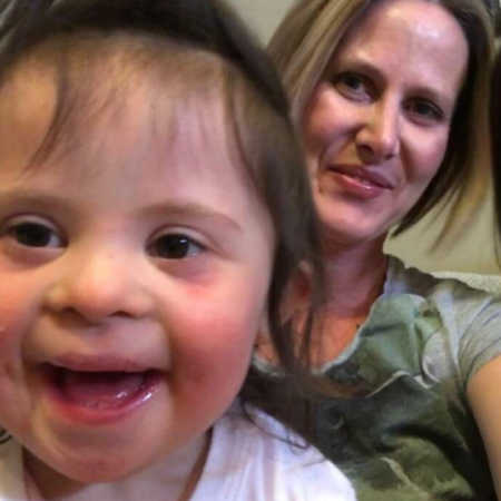 Mother smiles in selfie with baby daughter who has down syndrome