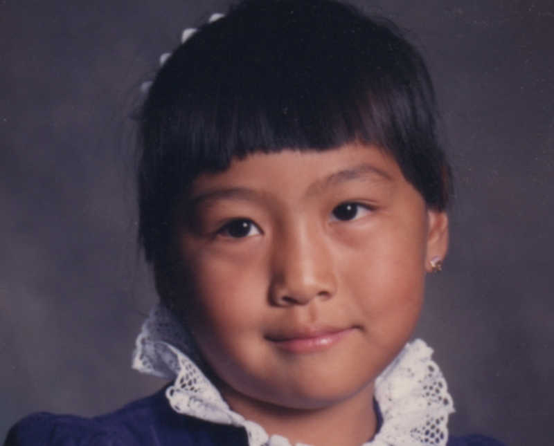 Adopted Korean girl smiles for school photo