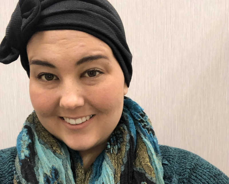 Woman who is undergoing treatment for Hodgkin's lymphoma smiles in selfie