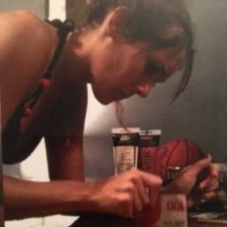 Woman crushing up pills on counter with card