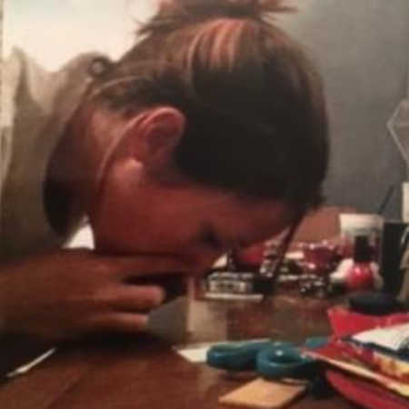 Woman snorting pills off of counter
