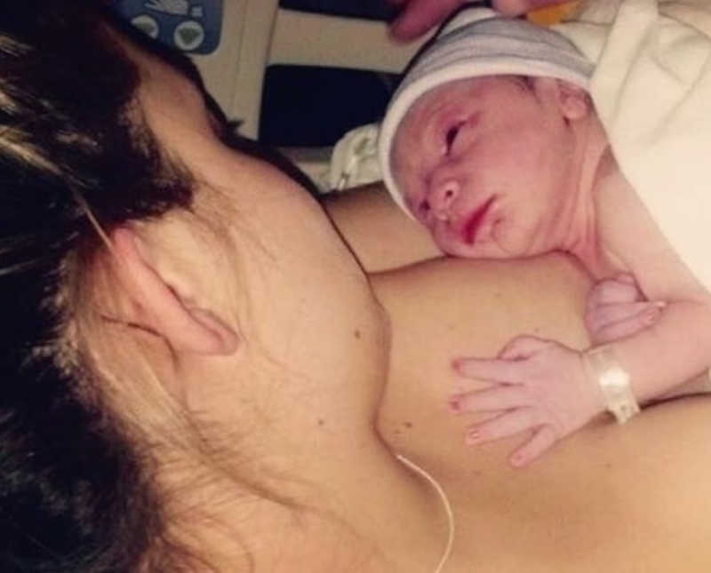 Newborn lays on bare chest of teen mother