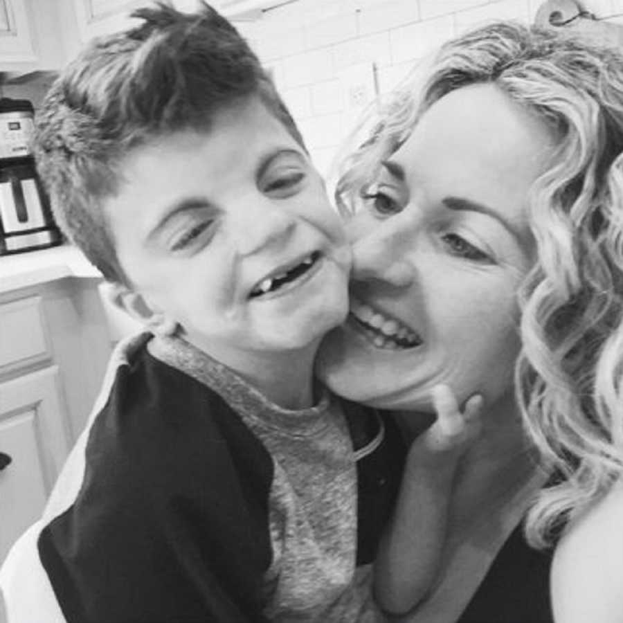 Mother smiles in selfie with son who has Cornelia de Lange Syndrome