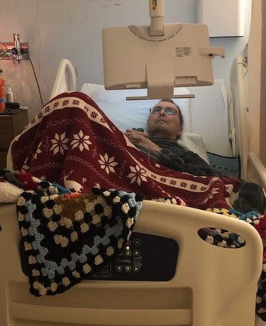 Man who had seizure lays in hospital bed watching tv