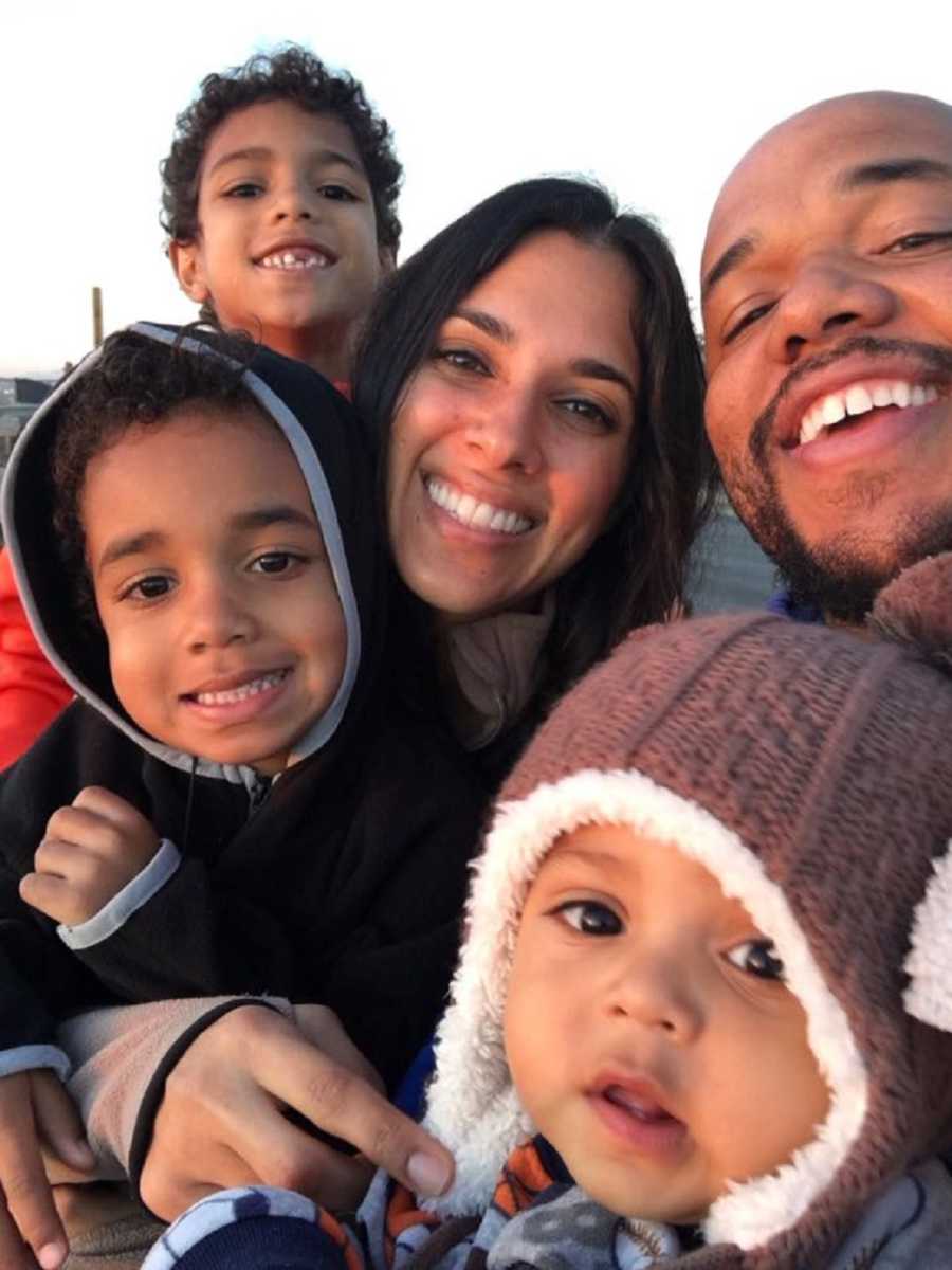 Woman who survived night club shooting smiles beside husband and three children