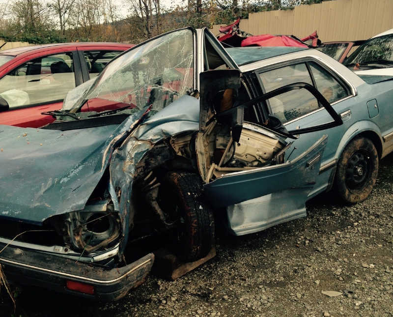 Car completely wrecked after car crash that woman should have died from but survived