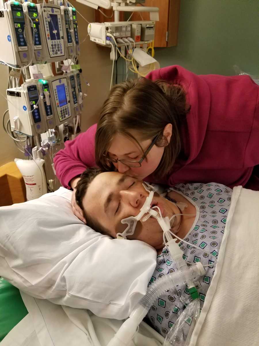 Woman leans over to kiss intubated husband in ICU who was brain dead