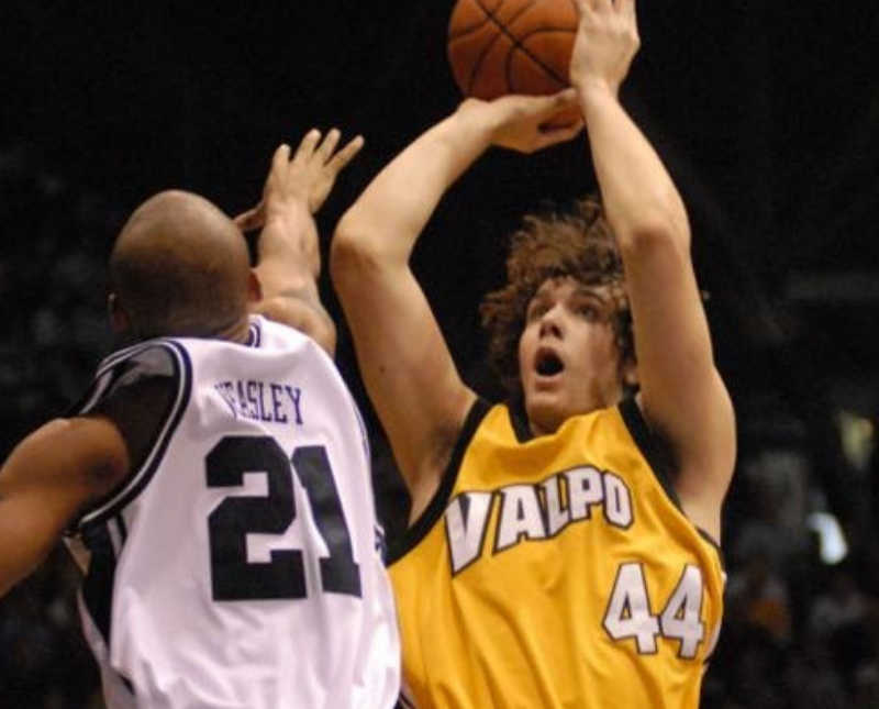 Man shoots basketball wearing Valparaiso jersey during game