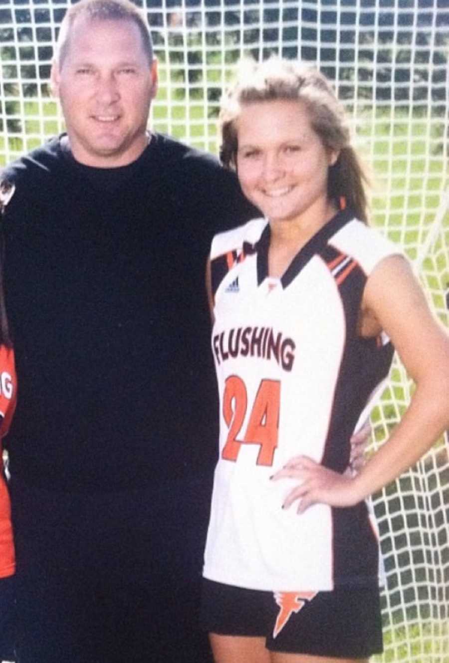 Teen stands in soccer uniform in front of goal beside her father who has since passed