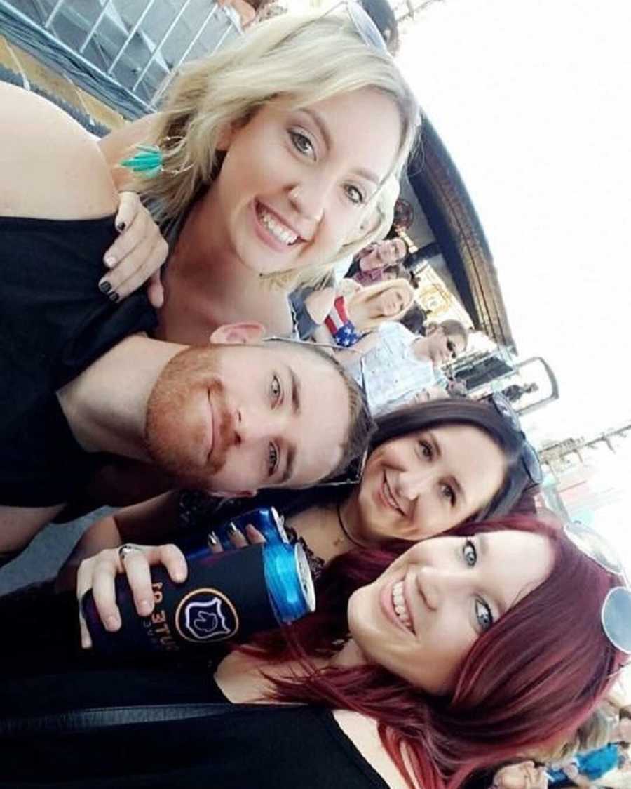 Man smiles in selfie with three other woman at country festival in Las Vegas where there was shooting