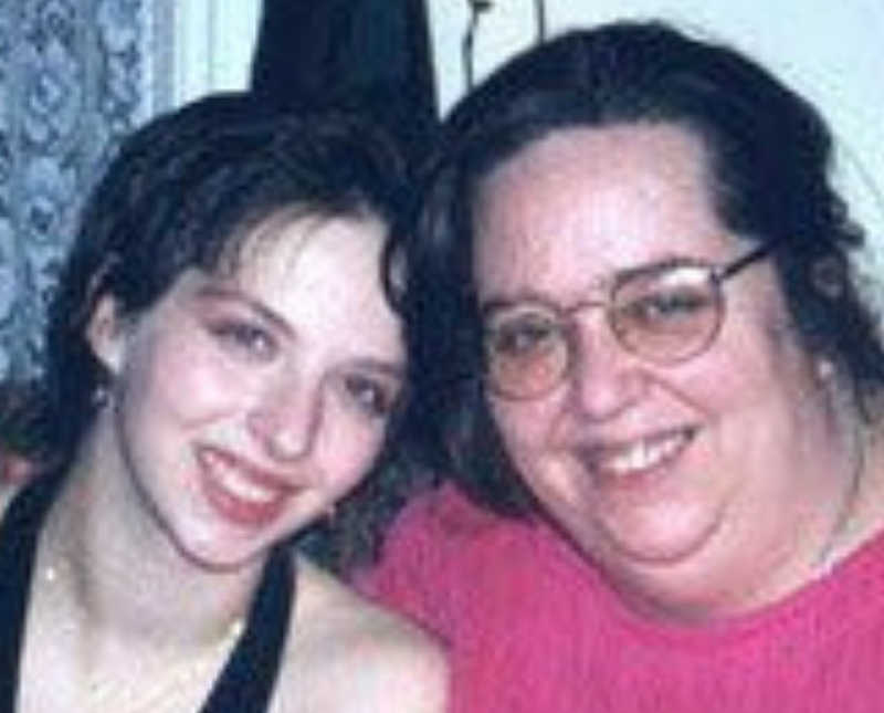 Teen who had an abortion smiles as she sits beside her mother