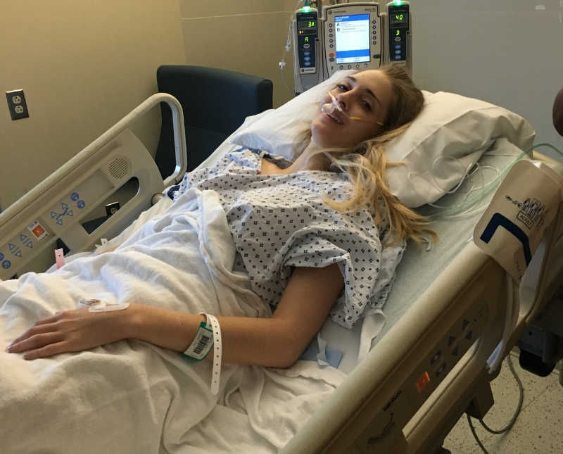Woman laying in hospital bed awaiting Total Proctocolectomy with a Permanent Ostomy