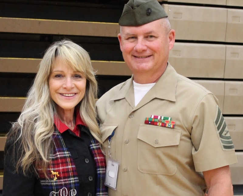 Woman diagnosed with cancer smiles beside husband who is in military